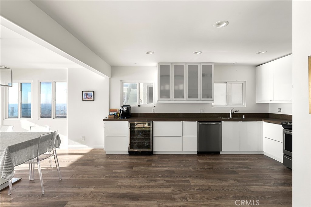 35661 Beach Road Dana Point, CA 92624 - Photo 15 of 52 a kitchen with stainless steel appliances granite countertop a stove and a sink