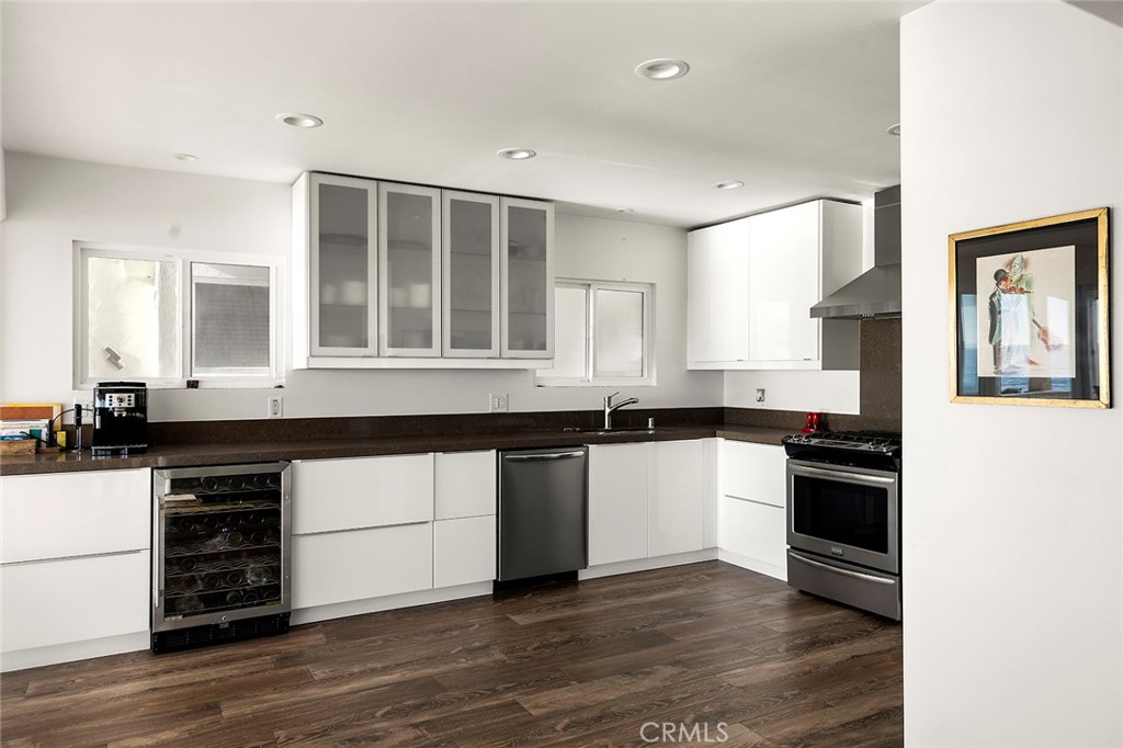 35661 Beach Road Dana Point, CA 92624 - Photo 16 of 52 a kitchen with granite countertop a stove and a sink
