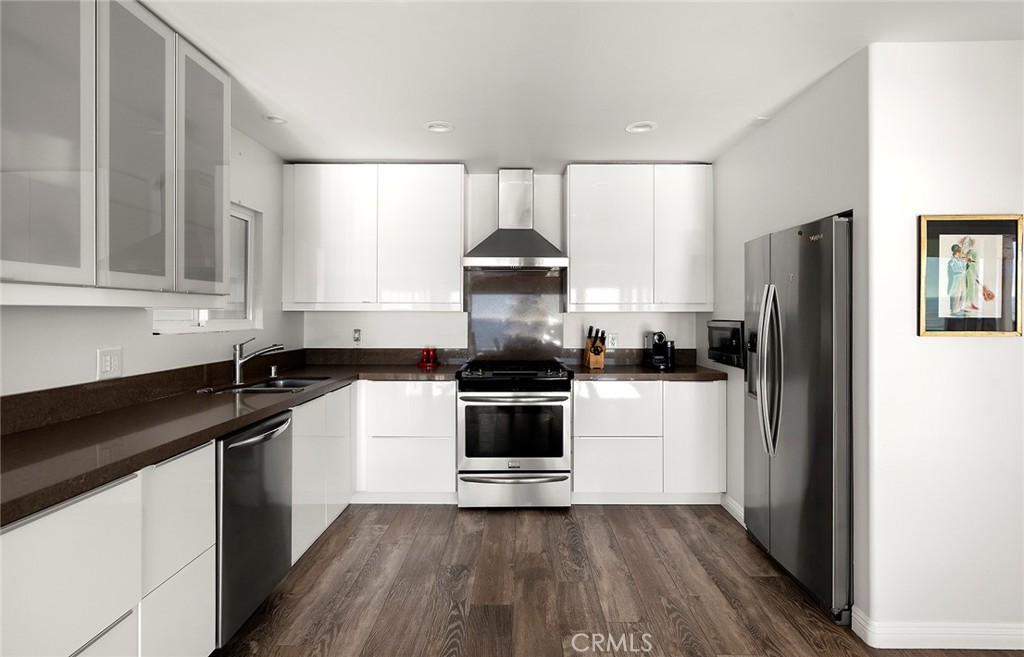 35661 Beach Road Dana Point, CA 92624 - Photo 17 of 52 a kitchen with a sink stove and refrigerator