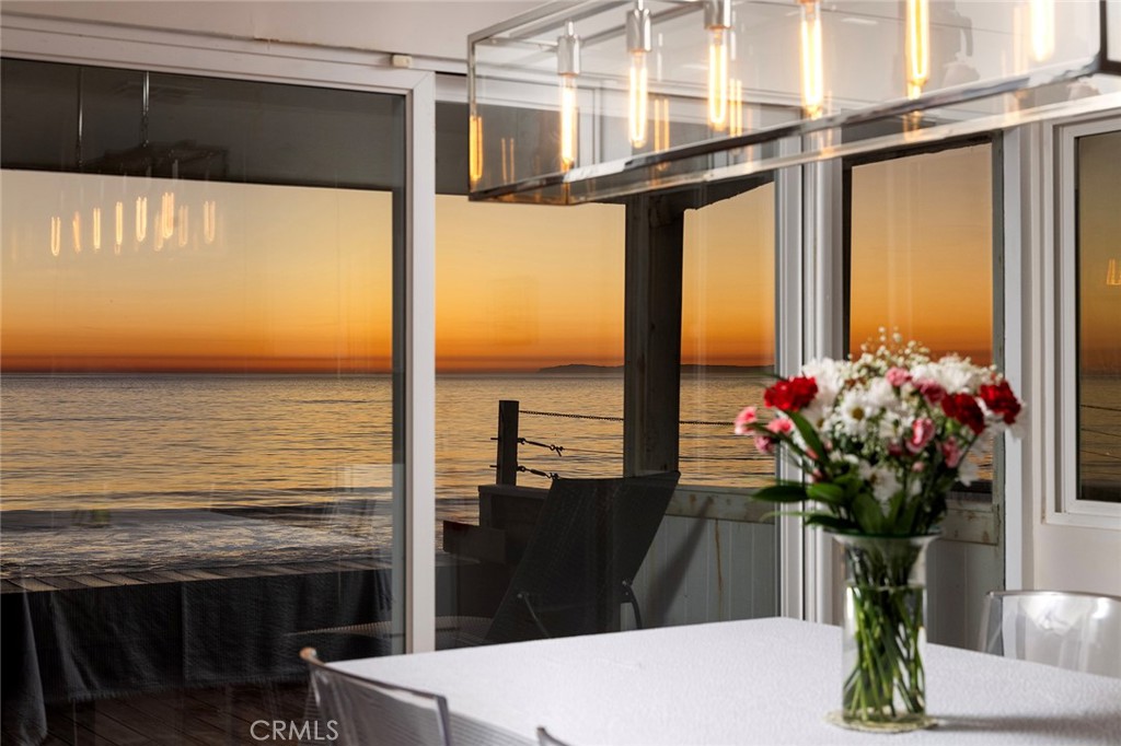 35661 Beach Road Dana Point, CA 92624 - Photo 22 of 52 a vase of flowers sitting on a table in front of a house