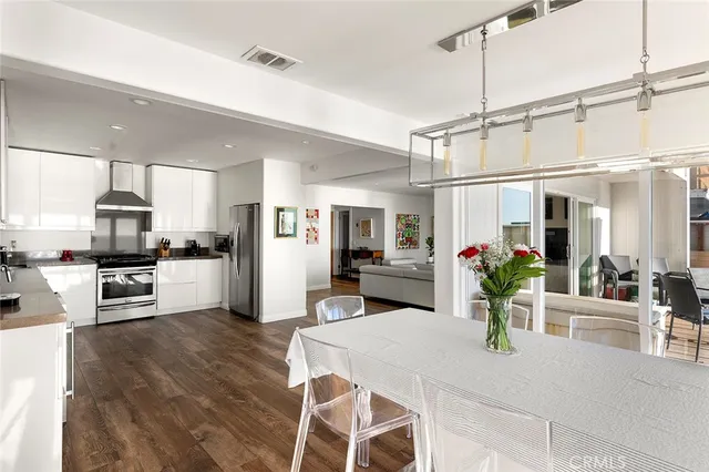 a bathroom with a sink and mirror with toilet