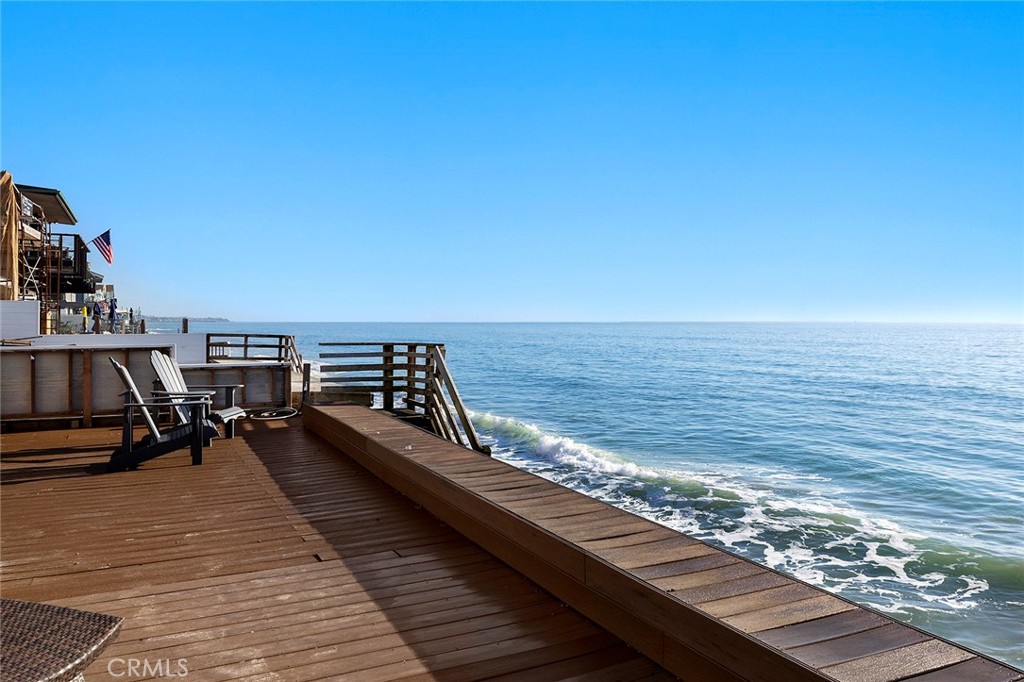 35661 Beach Road Dana Point, CA 92624 - Photo 31 of 52 a view of roof deck with two chairs and wooden floor