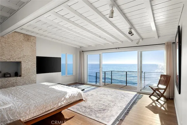 a view of roof deck with wooden floor and city view