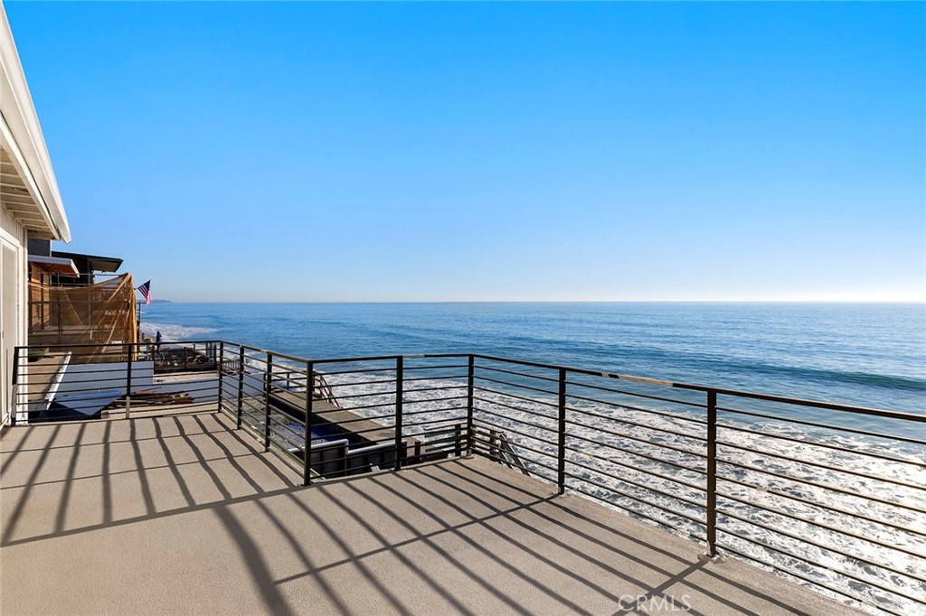 35661 Beach Road Dana Point, CA 92624 - Photo 43 of 52 a view of roof deck with wooden floor and city view