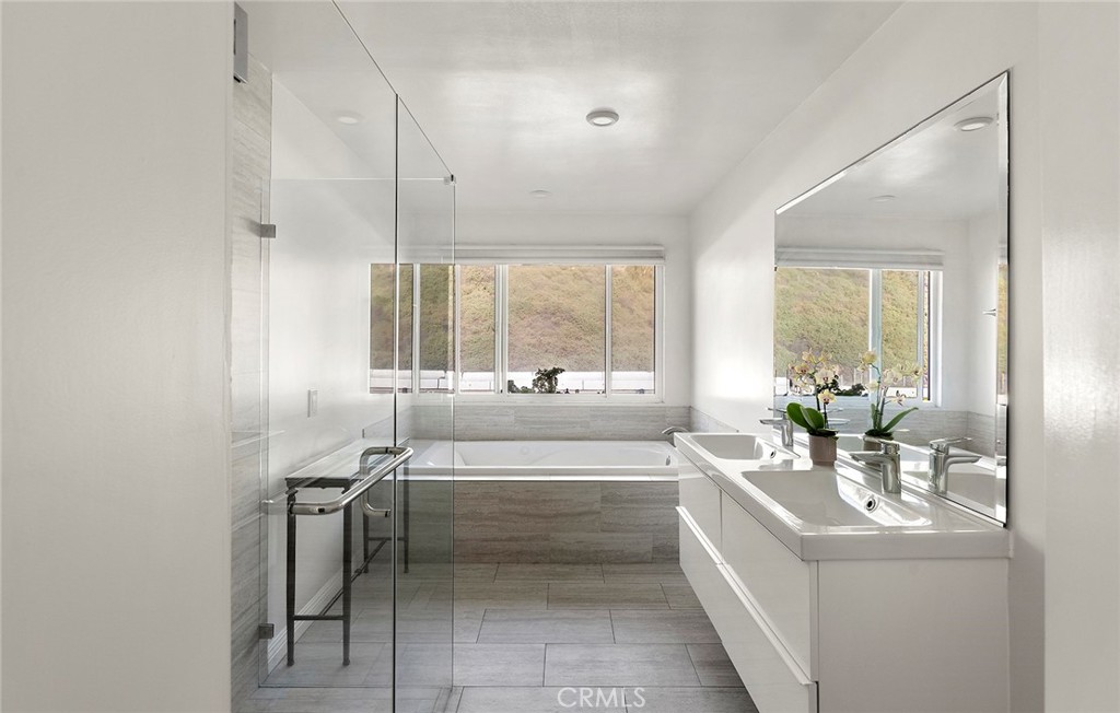 35661 Beach Road Dana Point, CA 92624 - Photo 47 of 52 a large white kitchen with a large window