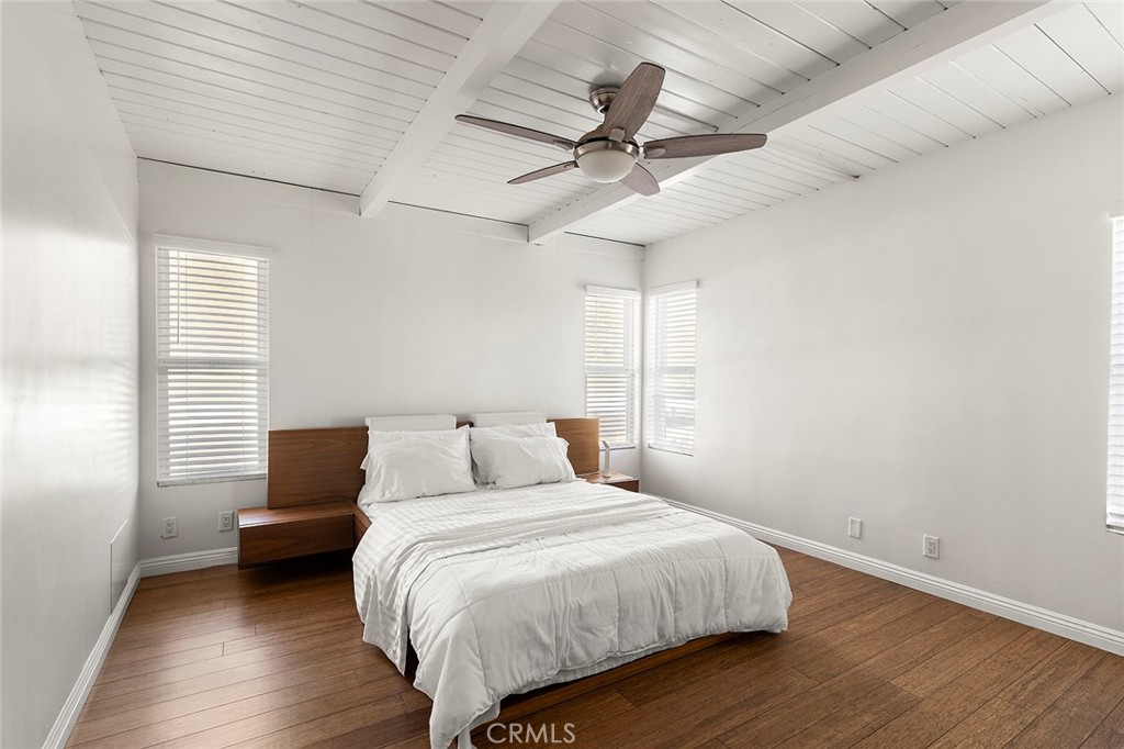 35661 Beach Road Dana Point, CA 92624 - Photo 49 of 52 a bedroom with a bed and a ceiling fan