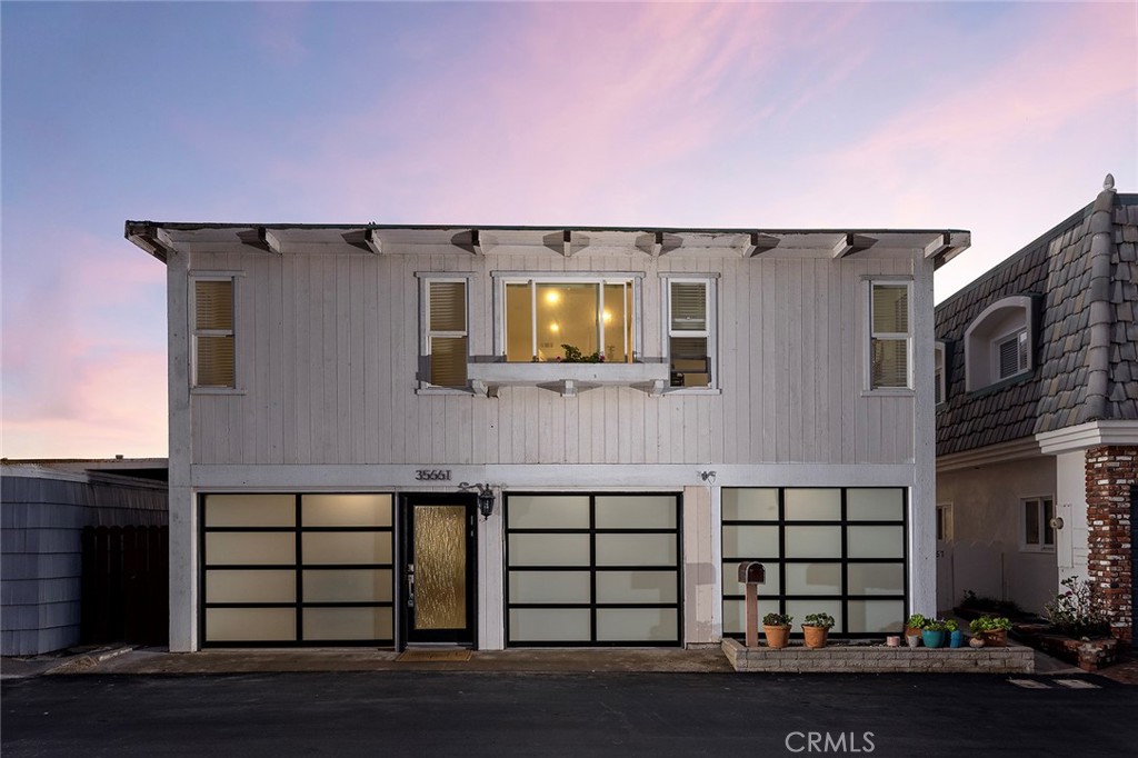 35661 Beach Road Dana Point, CA 92624 - Photo 6 of 52 a front view of a house with a yard