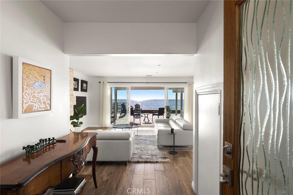 35661 Beach Road Dana Point, CA 92624 - Photo 9 of 52 a living room with furniture and wooden floor