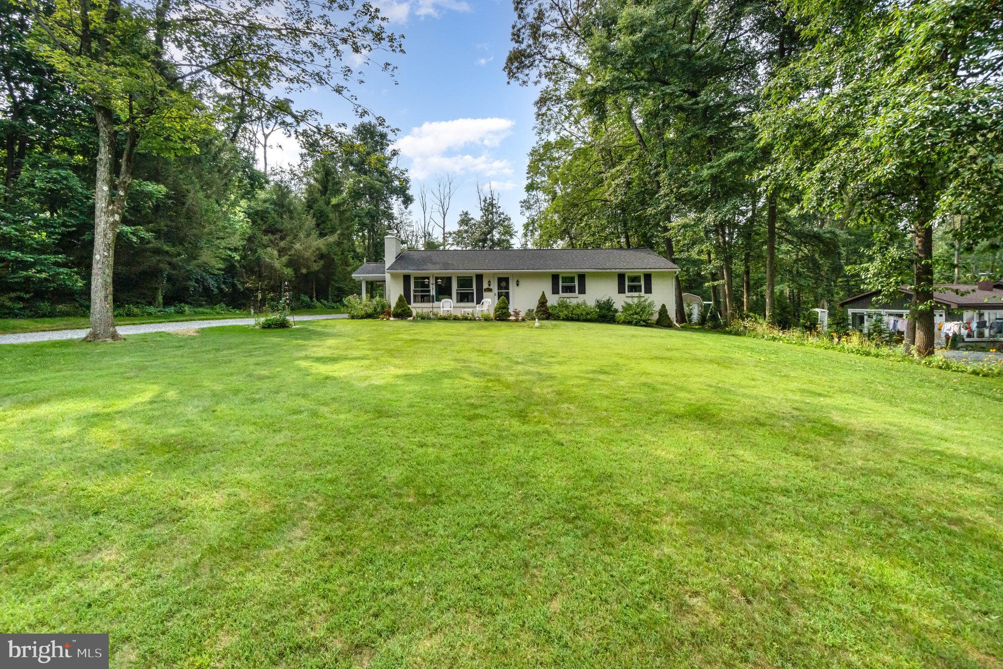 1890 Furnace Hill Road Denver, PA 17517 - Photo 4 of 29 Charming home nestled in lush greenery.