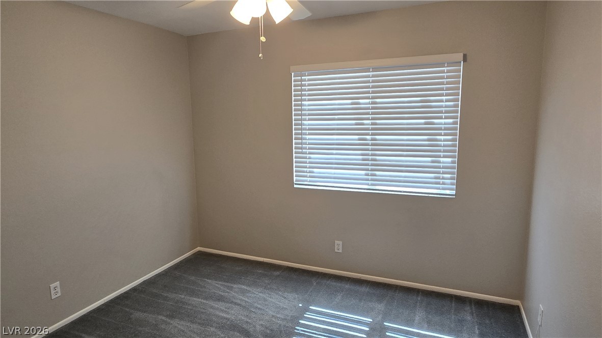 3849 Reflection Way Las Vegas, NV 89147 - Photo 10 of 25 A well-proportioned bedroom with ample natural light and plush carpeting offers a comfortable retreat.
