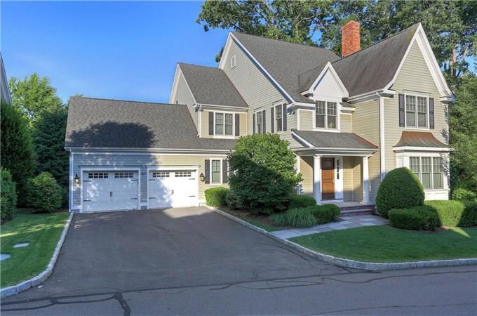 631 Long Ridge Road, Unit 16 Stamford, CT 06902 - Photo 1 of 1 a view of a white house next to a yard and large trees