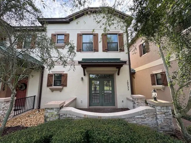 a front view of a house with garden