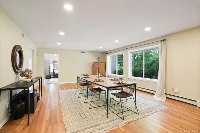 a view of a dining room with furniture window and wooden floor