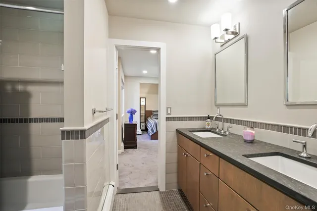 a bathroom with a double vanity sink mirror and double