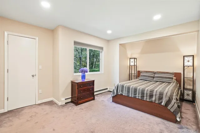 a bedroom with a bed and a cabinets