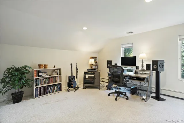 a view of a workspace with furniture