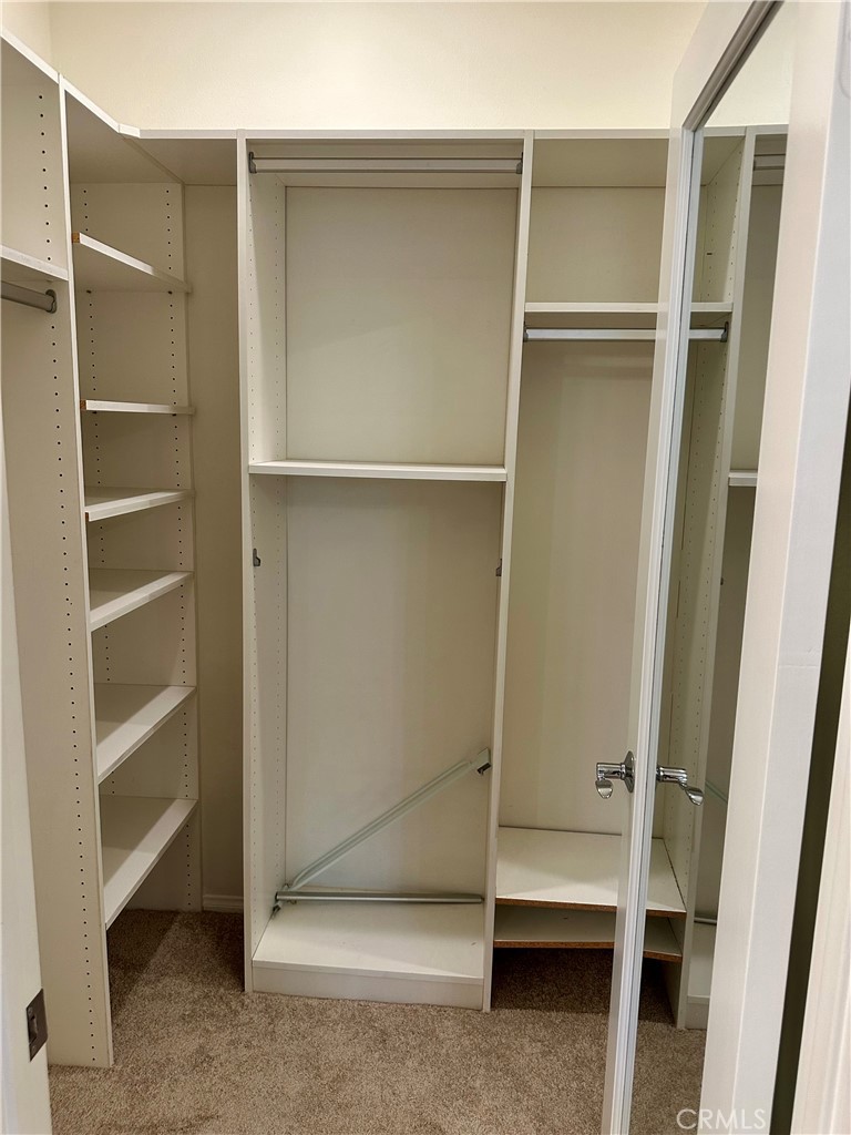 21 Durlston Way Ladera Ranch, CA 92694 - Photo 26 of 47 a view of walk in closet with empty racks
