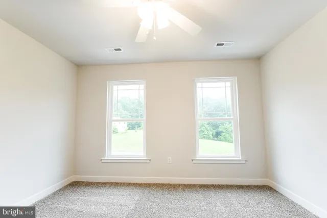 a view of kitchen view wooden floor and electronic appliances