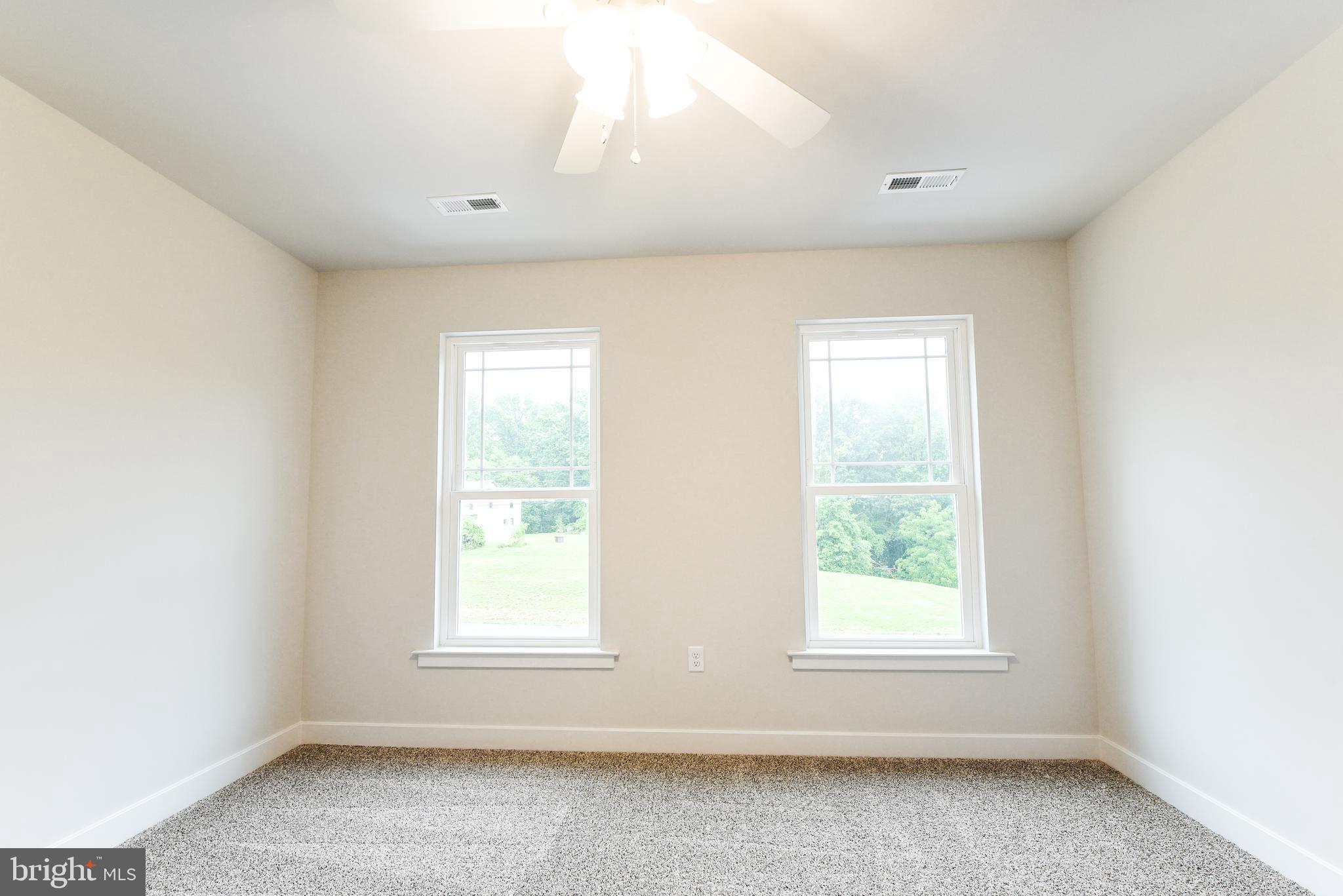 10631 Plank Road Spotsylvania, VA 22553 - Photo 21 of 26 an empty room with windows