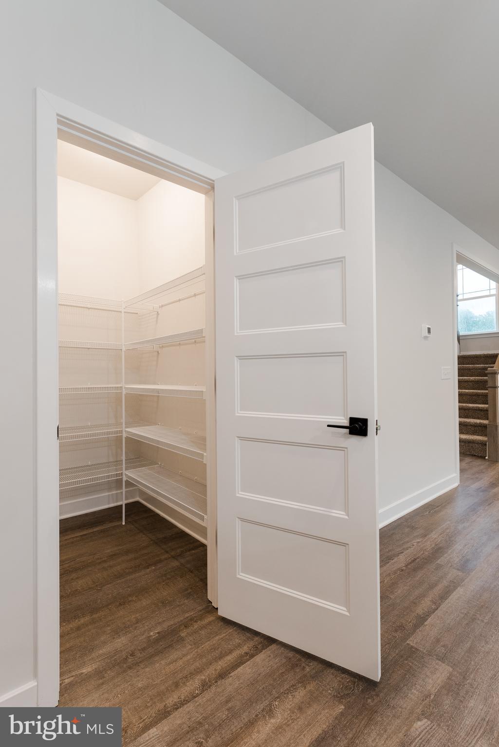 10631 Plank Road Spotsylvania, VA 22553 - Photo 4 of 26 a view of a room with wooden floor