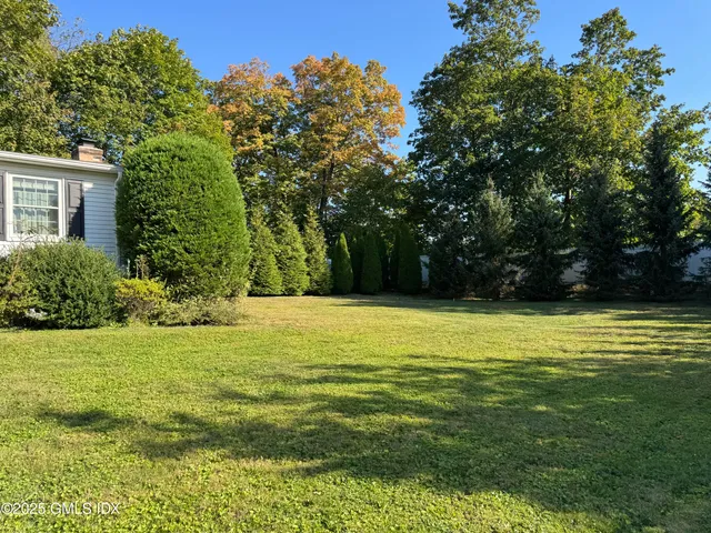 a view of a pool with a yard