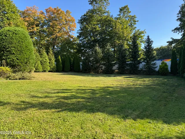 a view of a swimming pool with an outdoor space and seating area