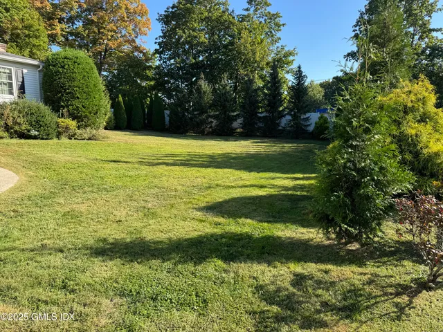 a view of a garden with a fountain