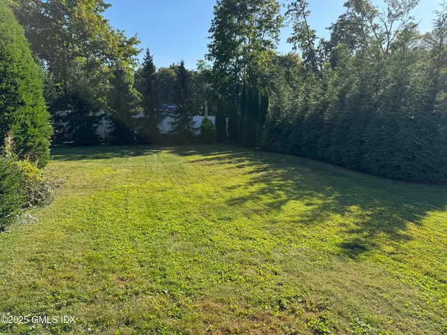 a view of a swimming pool with a yard