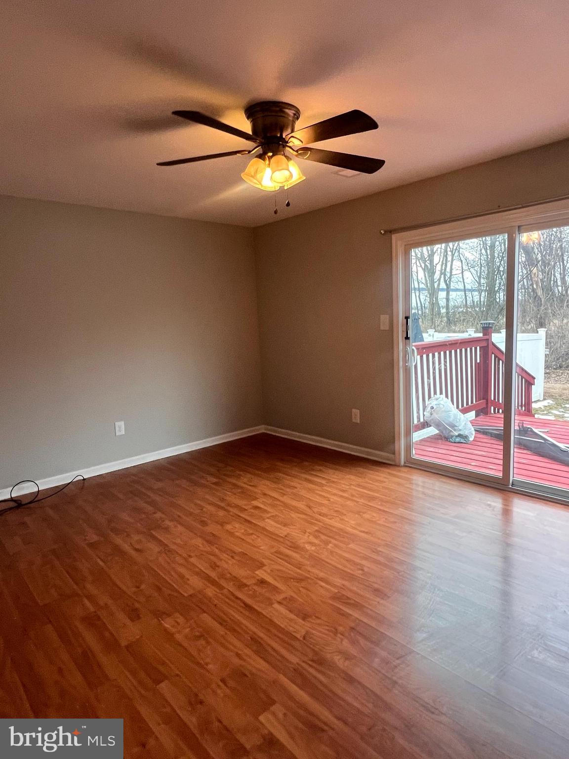 388 Dorothy Court Inwood, WV 25428 - Photo 12 of 19 a view of an empty room with wooden floor and a window
