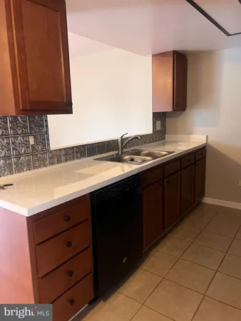 a bathroom with a sink vanity and mirror