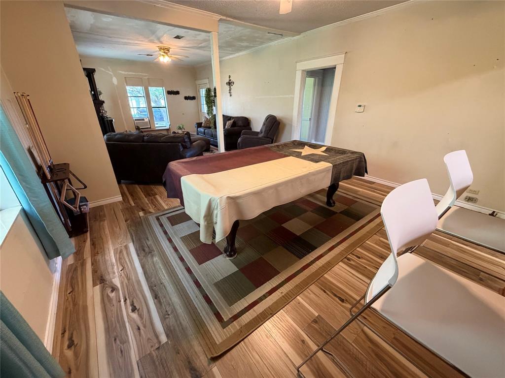 8041 Highway 11 Whitewright, TX 75491 - Photo 6 of 14 a living room with a couch table and chairs