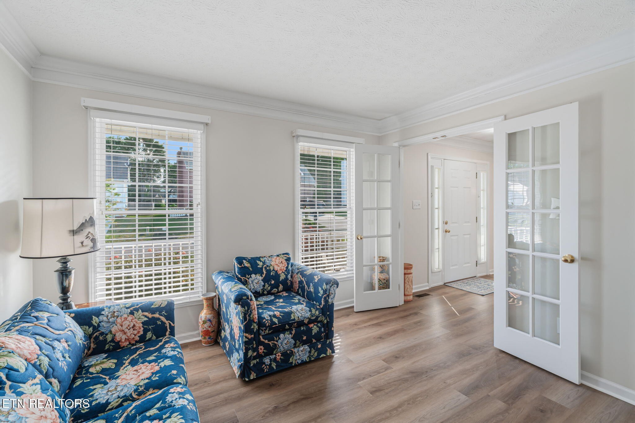 7030 Westerly Winds Road Knoxville, TN 37931 - Photo 11 of 40 a living room with furniture and wooden floor