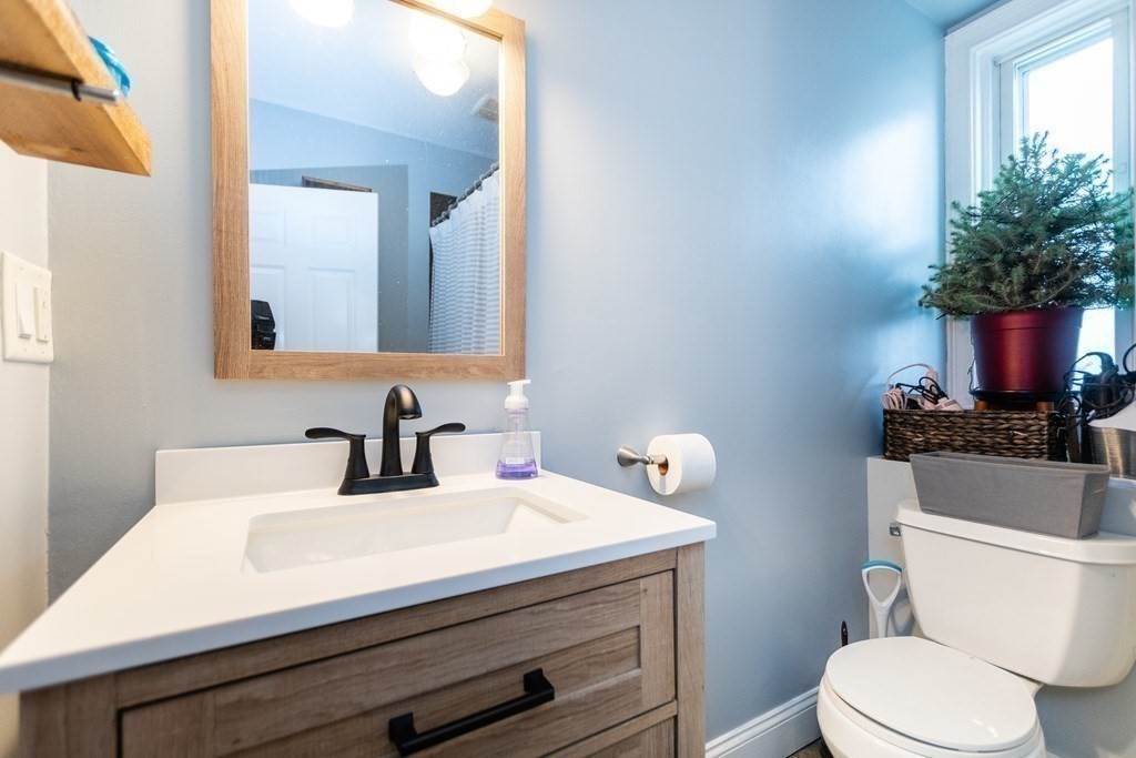 10 Beacon Street, Unit 3 Chelsea, MA 02150 - Photo 14 of 29 a bathroom with a sink toilet and mirror