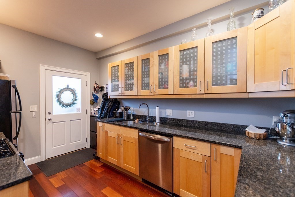 10 Beacon Street, Unit 3 Chelsea, MA 02150 - Photo 17 of 29 a kitchen with stainless steel appliances granite countertop a stove and a sink