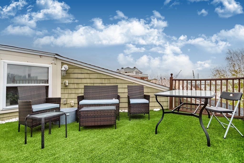 10 Beacon Street, Unit 3 Chelsea, MA 02150 - Photo 23 of 29 a view of a chair and table in the garden
