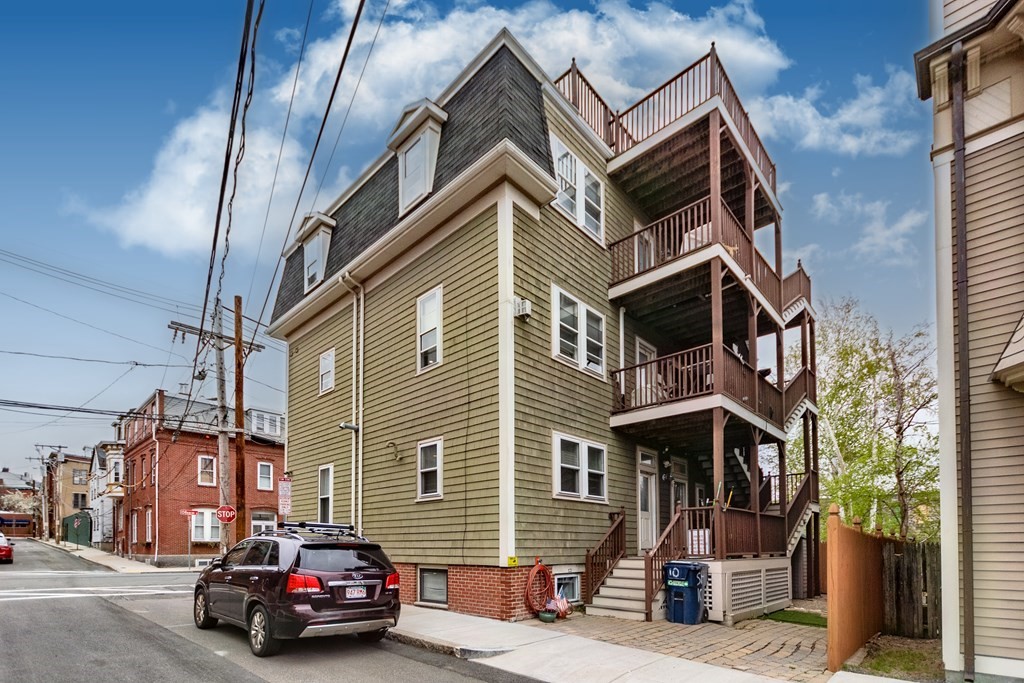 10 Beacon Street, Unit 3 Chelsea, MA 02150 - Photo 26 of 29 a car parked in front of a building