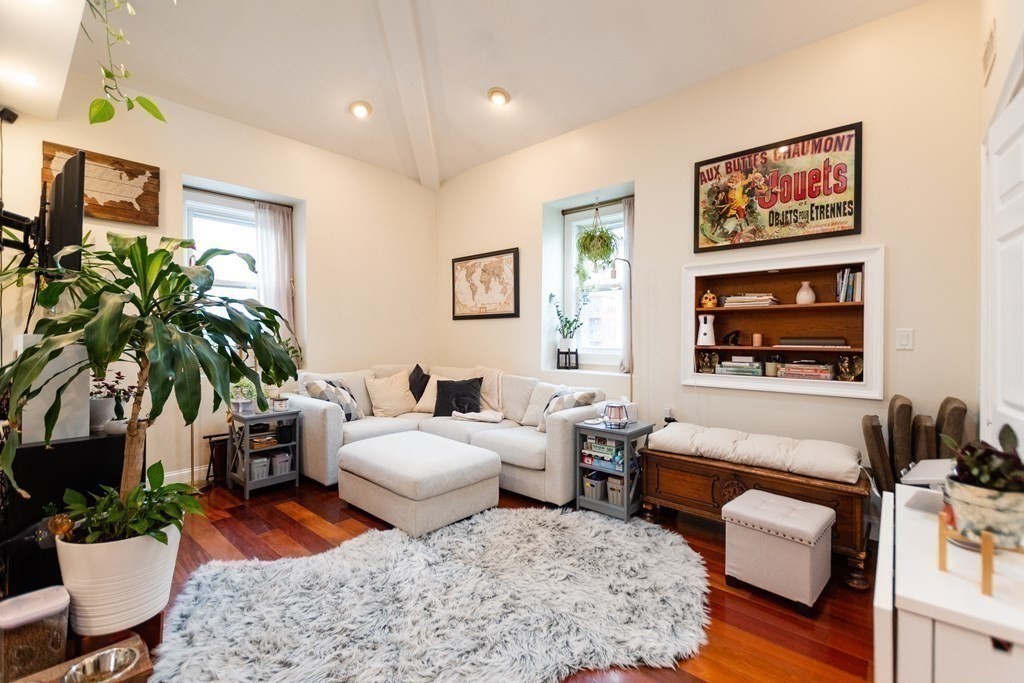 10 Beacon Street, Unit 3 Chelsea, MA 02150 - Photo 5 of 29 a bedroom with furniture and a potted plant
