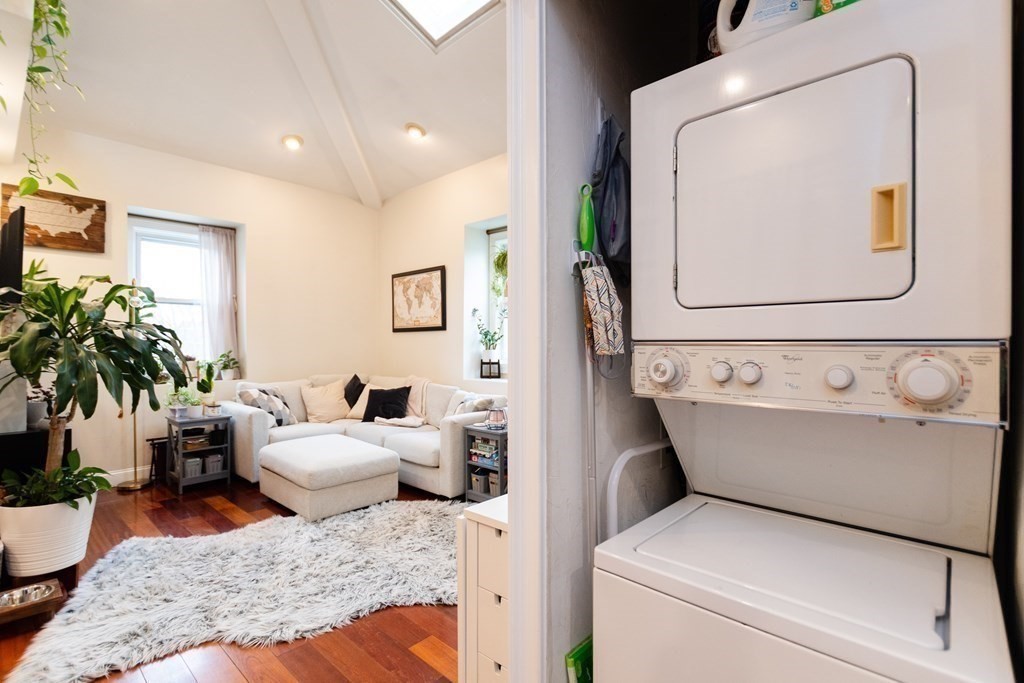 10 Beacon Street, Unit 3 Chelsea, MA 02150 - Photo 10 of 29 a living room with furniture and potted plant