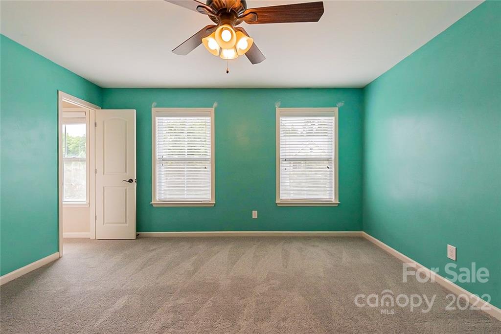 2138 Bluebell Way Tega Cay, SC 29708 - Photo 11 of 20 a view of room with window and ceiling fan
