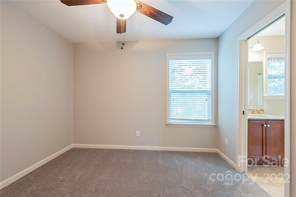 2138 Bluebell Way Tega Cay, SC 29708 - Photo 13 of 20 an empty room with a window and wooden floor