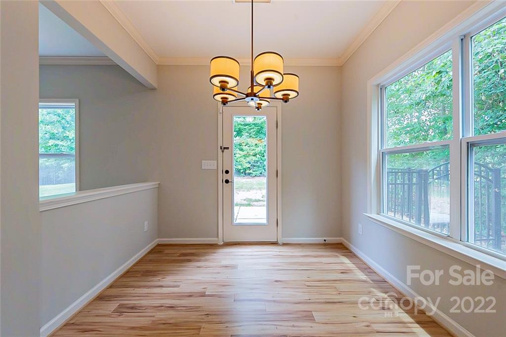 2138 Bluebell Way Tega Cay, SC 29708 - Photo 6 of 20 a view of a room with wooden floor and a window