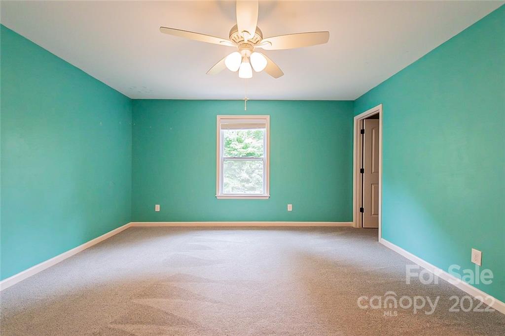 2138 Bluebell Way Tega Cay, SC 29708 - Photo 10 of 20 a view of an empty room with a window