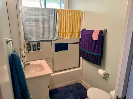 a bathroom with a toilet and a sink