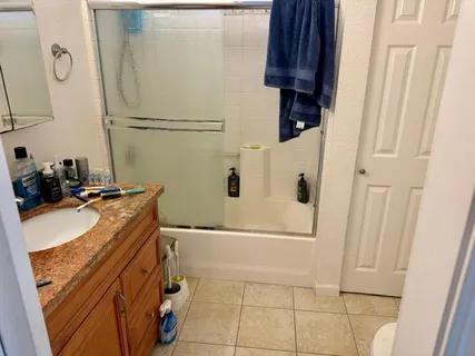 a bathroom with a tub and a shower