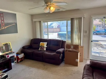 a living room with furniture and a window