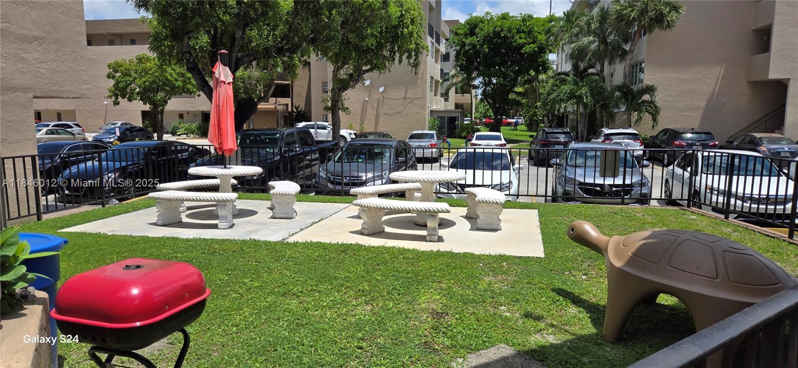 816 Northwest 87th Avenue, Unit 107 Miami, FL 33172 - Photo 20 of 20 a view of a backyard with a patio and fire pit