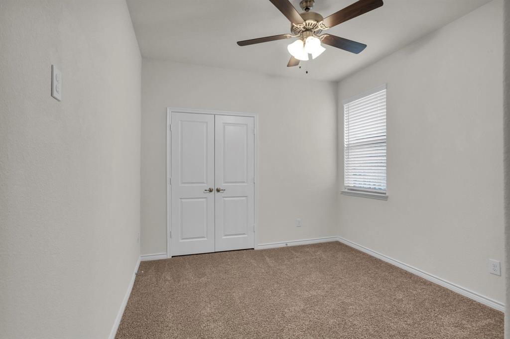 3106 Maverick Drive Forney, TX 75126 - Photo 15 of 32 a view of an empty room and chandelier fan