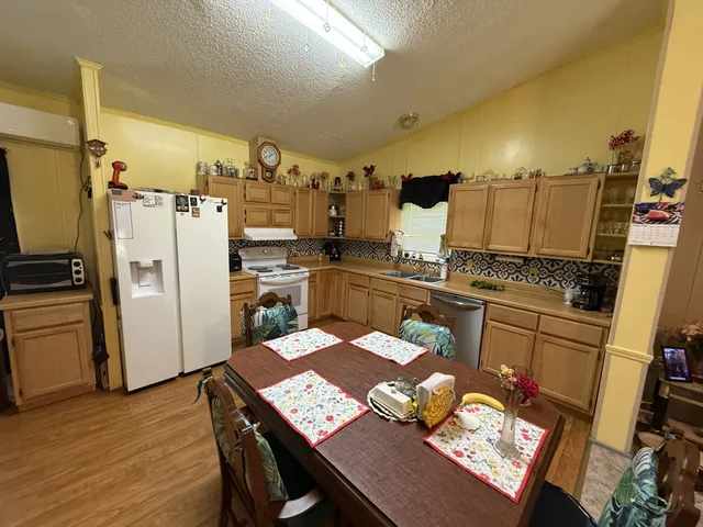 a view of walk in closet with clothes