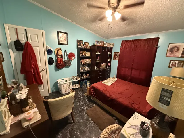 a backyard of a house with lots of green space and fountain