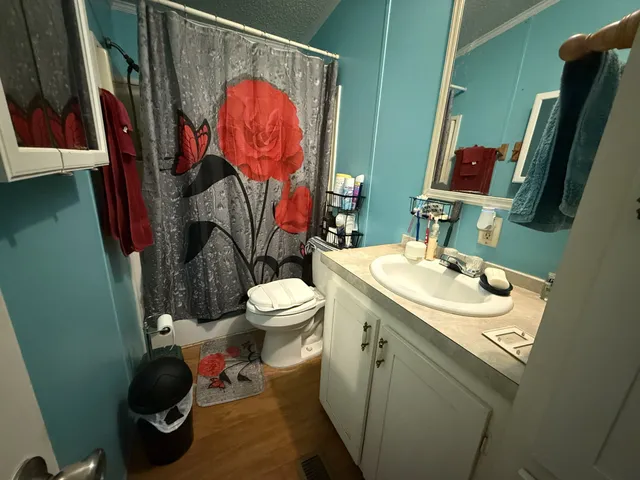 a view of a chair and table on the garden